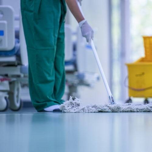 cleaner mopping the floor in a hospital 