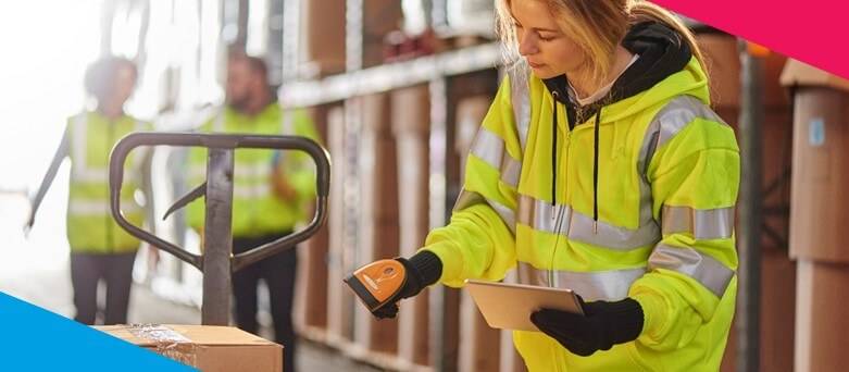 Wahouse Essential Skills  - Femal Warehouse Operative scanning a box on a pallet
