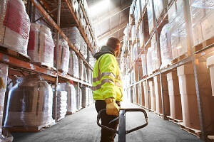 Warehouse Career Prospects  - Male Warehouse Operative, pulling a pallet 