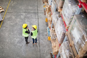Warehouse FAQ's, two warehouse workers chatting